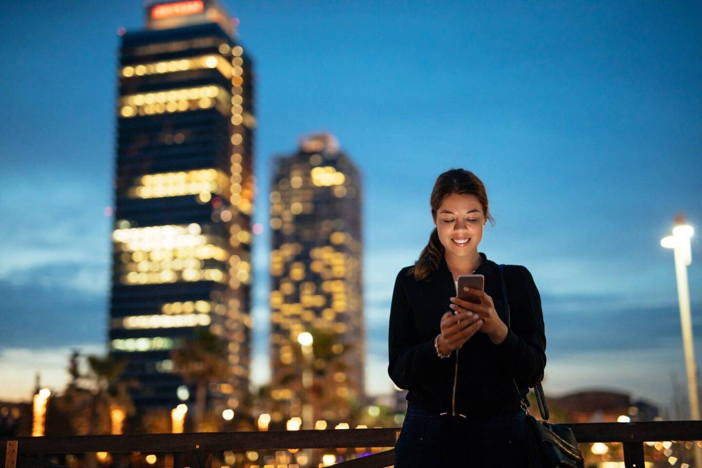 woman on her phone in a city