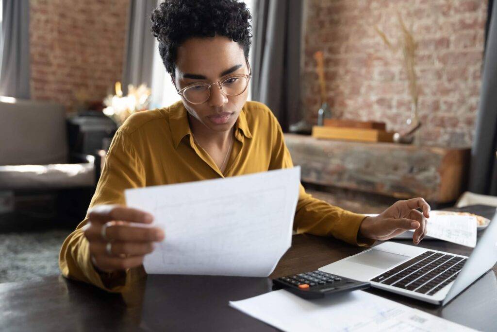 Woman reading a sheet of paper