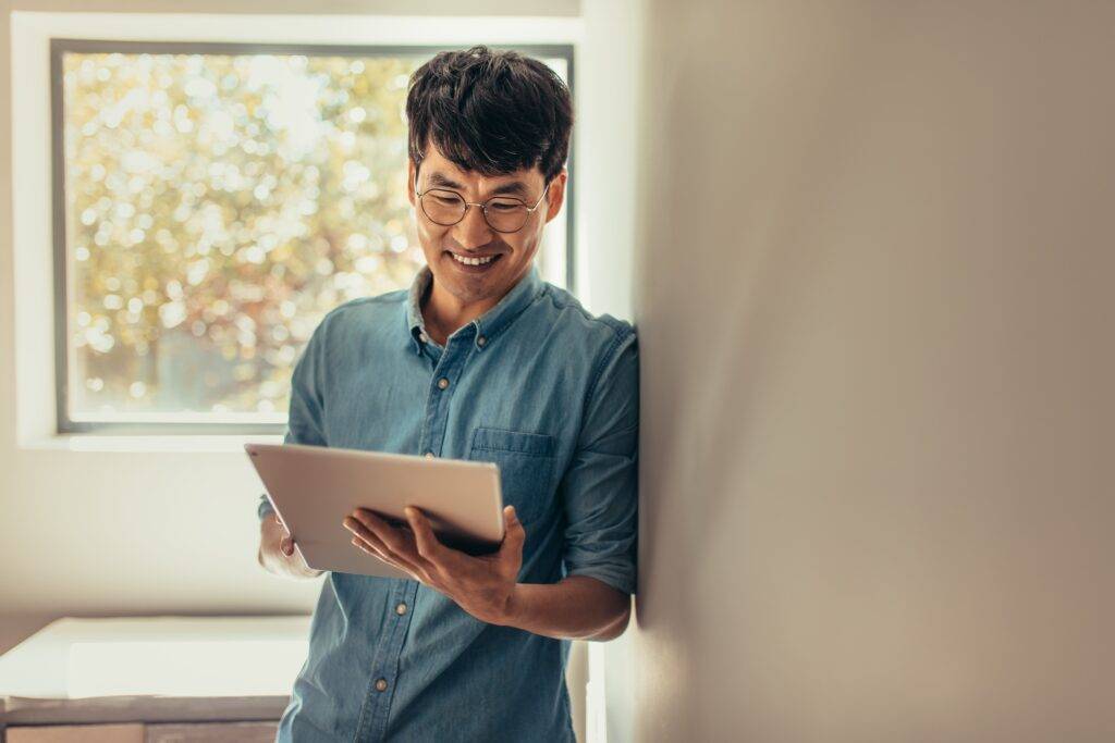 man looking at tablet